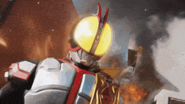 a masked rider is standing in front of a building that is on fire