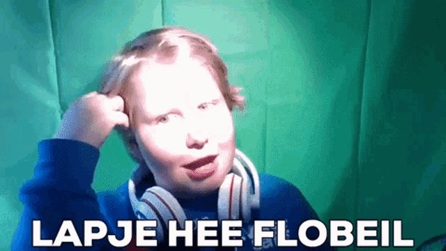 a young boy wearing headphones is making a funny face with the words lap je hee flobeil written below him