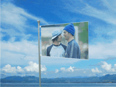 a flag that has a picture of a man in a blue hat on it