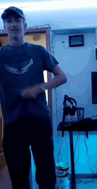 a man wearing a burton t-shirt is dancing