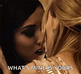 a couple of women are kissing each other and one of them is asking what 's mine is yours .