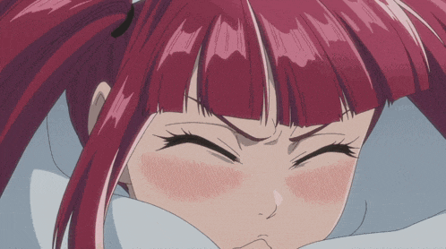 a close up of a girl with red hair