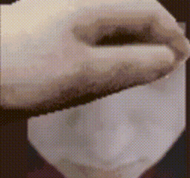 a close up of a person 's face with a blurred background