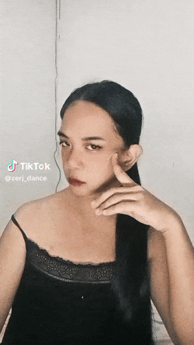 a woman 's face is shown in a tiktok video by zerj_dance