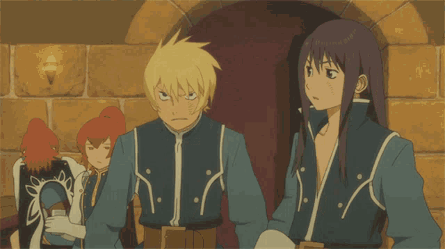 a man and a woman are standing next to each other and the man is making a funny face