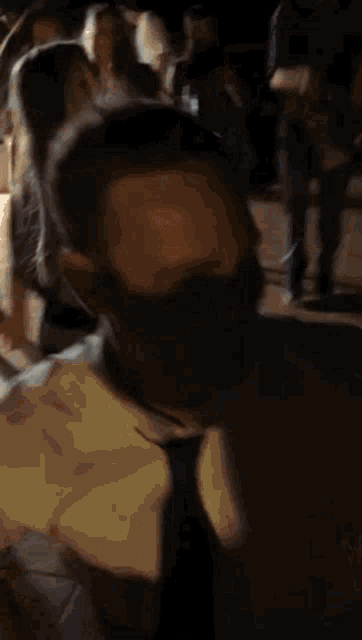 a man in a suit and tie is dancing in a crowd of people .