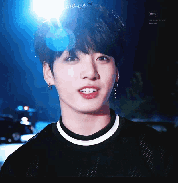 a close up of a young man 's face with the words bts jungkook day written on the bottom