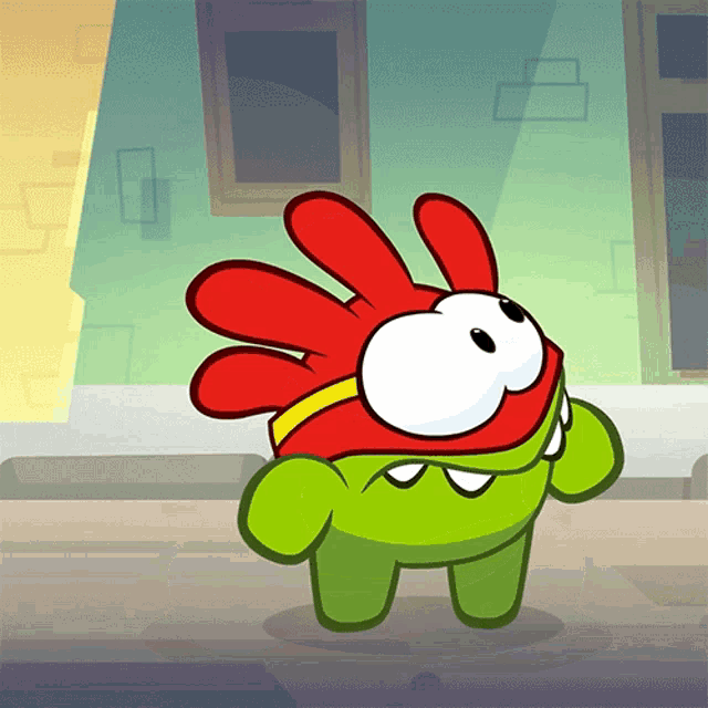a green cartoon character with red hair and a yellow band around his neck