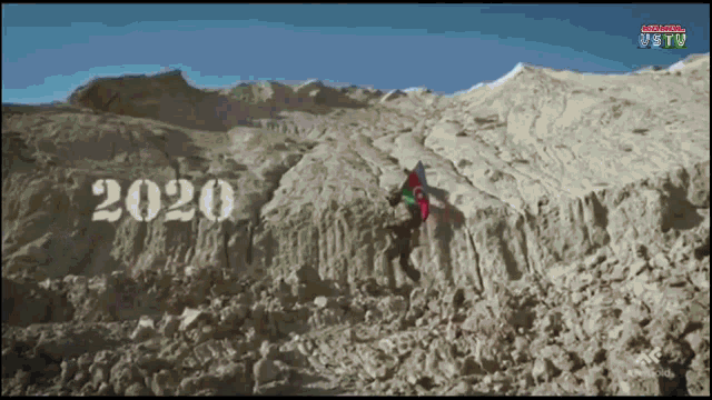 the year 2020 is displayed on a mountain