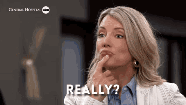 a woman with a questioning look on her face and the words " really " below her