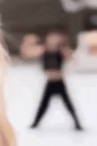 a blurry picture of a person standing on their feet