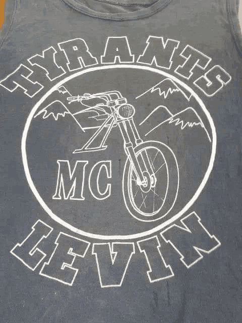 a black tank top with a picture of a motorcycle and the words tyrants mc cevin