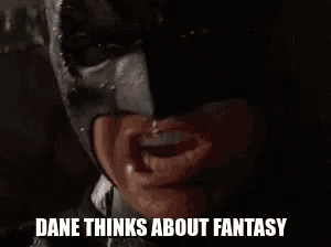 a close up of a person wearing a batman mask .