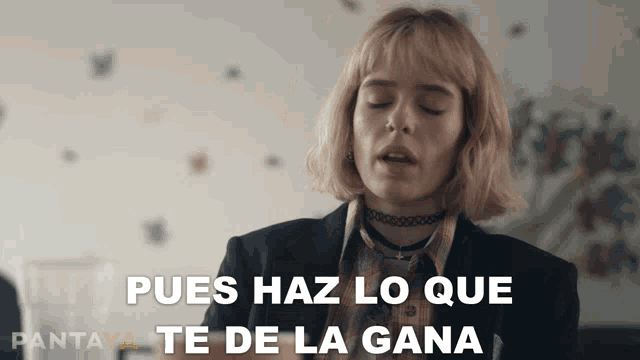 a woman says pues haz lo que te de la gana in spanish