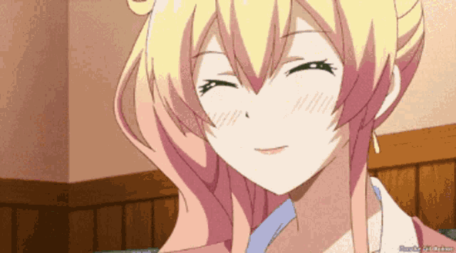 a girl with blonde hair is smiling with her eyes closed in a cartoon
