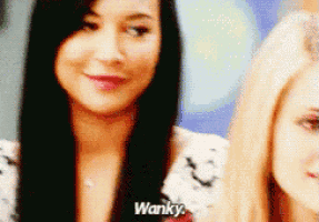a woman with long black hair says wanky next to another woman