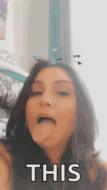 a woman is sticking her tongue out with the words this written below her