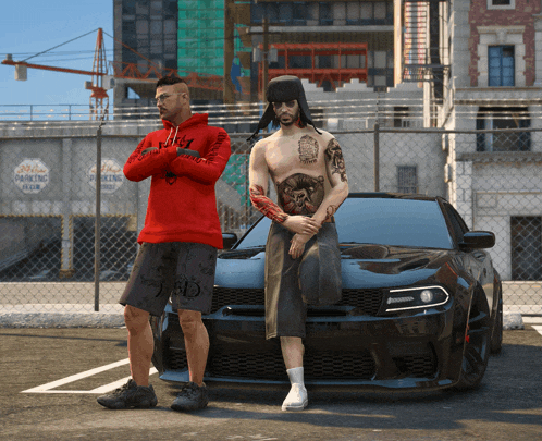 a man in a red hoodie is standing next to a man in a black car