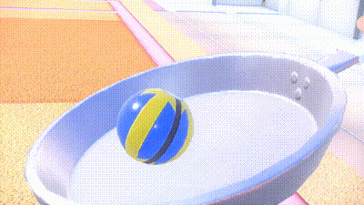 a blue and yellow ball is floating in a white bowl .