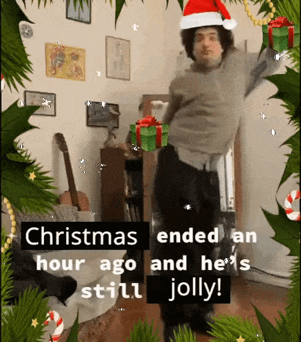 a man wearing a santa hat is dancing in a room with christmas decorations