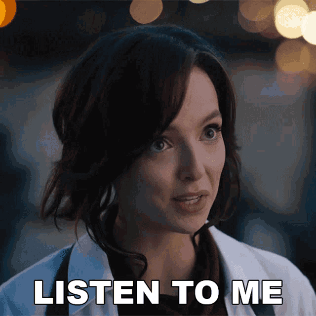 a woman says listen to me in front of her face