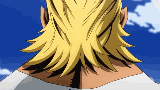a close up of a person 's back with a blue sky behind them