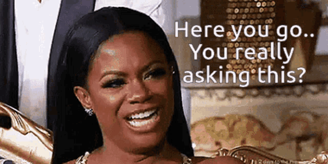 a woman is smiling and saying here you go you really asking this ?