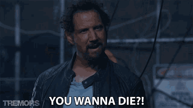 a man says " you wanna die " in a scene from tremors