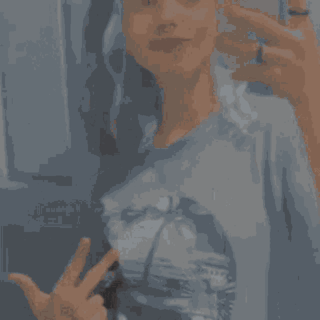 a girl is taking a picture of herself with her phone