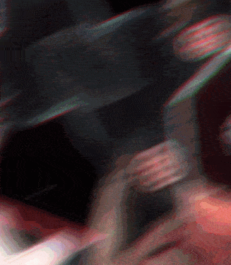 a blurred image of a person holding a skateboard