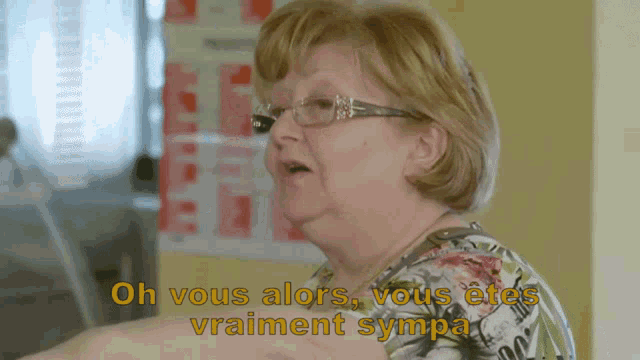 an older woman wearing glasses says " oh vous alors "
