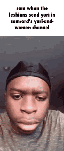a man is making a funny face while wearing a hat .