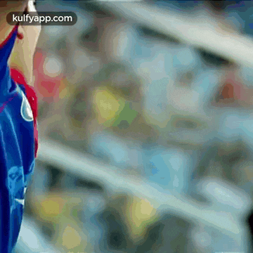 a blurred image of a person with the words kulfyapp.com at the top