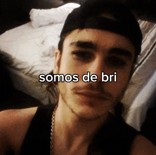 a man taking a selfie with the words somos de bri above his face