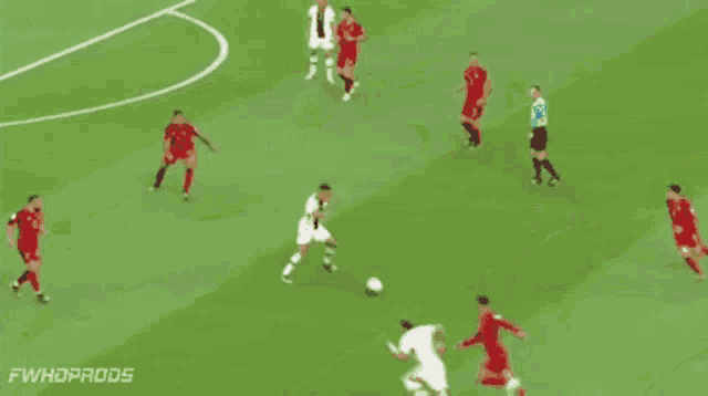 a group of soccer players are playing on a field with the number 11 on their jersey