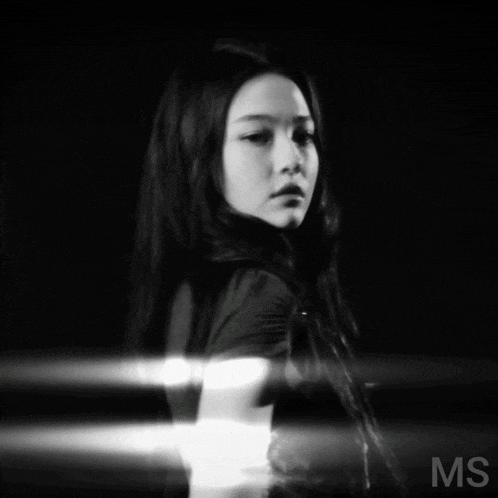 a black and white photo of a woman with ms on the bottom right