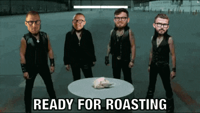 a group of men standing around a table with the words ready for roasting on the bottom