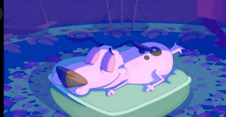 courage the cowardly dog is laying on a green cushion
