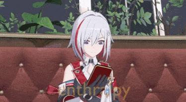 a girl sitting on a red couch with the word enthalpy on the bottom left