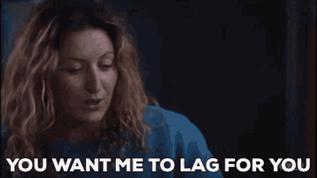 a woman in a blue sweater is talking to someone and says `` you want me to lag for you '' .