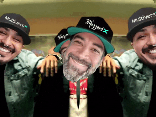 a man wearing a hat that says blizzard is surrounded by other men