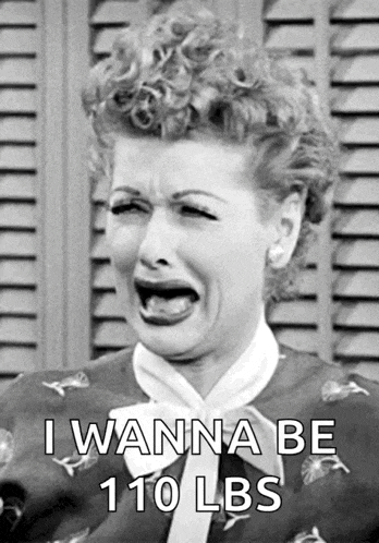 a black and white photo of a woman crying with the words i wanna be 110 lbs below her