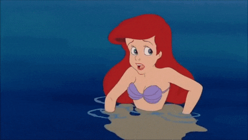 ariel from the little mermaid is swimming in the ocean next to a yellow fish