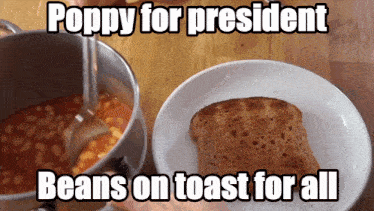 a pot of baked beans next to a plate of toast