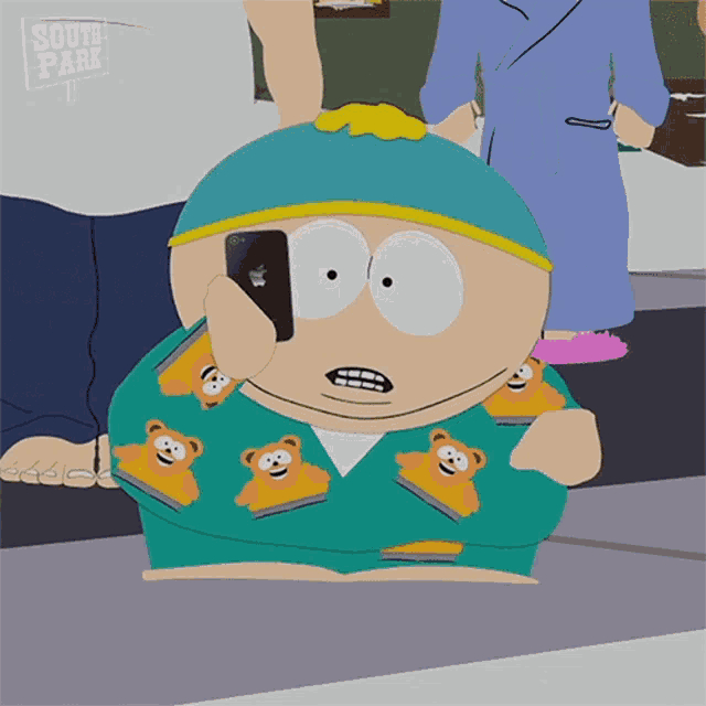 a cartoon character from south park is looking at his cell phone