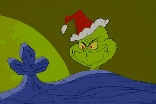 a cartoon of grinch wearing a santa hat and smiling