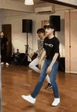 a group of people are dancing in a dance studio .