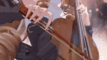 a woman is playing a violin with a bow