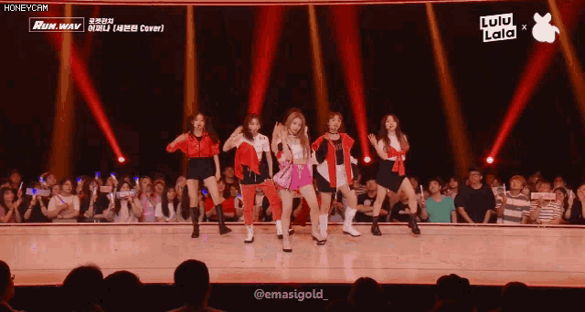 a group of girls are dancing on a stage with the words lulu lala written on the bottom