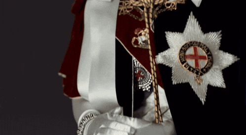 a person wearing a badge that says ' king george ii ' on it